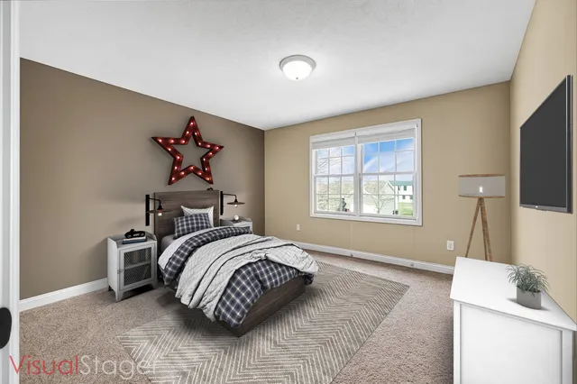 a bedroom with a bed and a flat screen tv