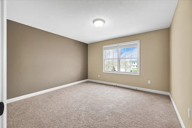 a view of an empty room with windows