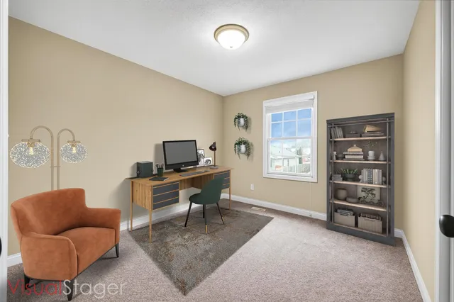 a work room with furniture and a window