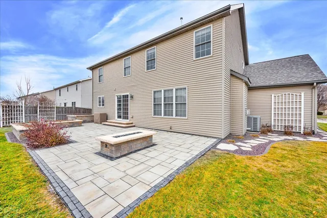 a front view of house with yard outdoor seating and barbeque oven