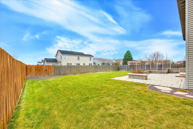a view of swimming pool with outdoor seating and city view