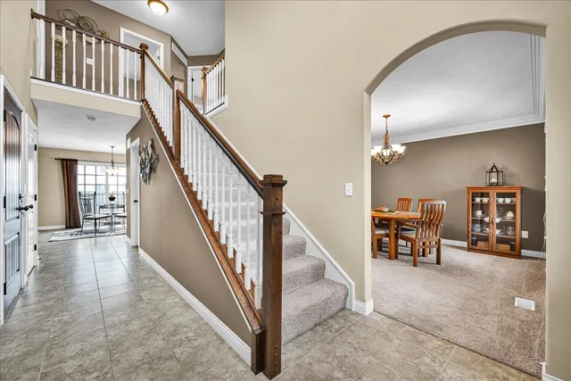 a view of a livingroom with furniture and a staircase