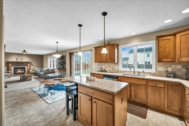 a kitchen with a stove a sink a counter space and dining table