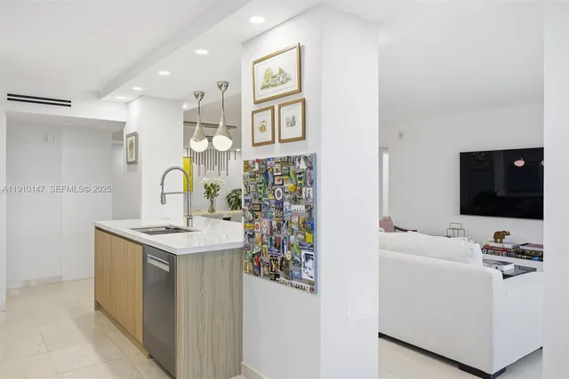 a view of living room with furniture and flat screen tv