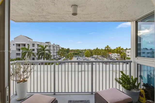 a view of a balcony with furniture
