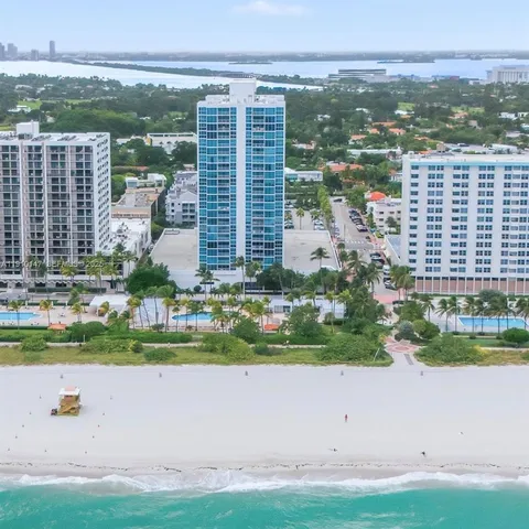 a view of a living room and chandelier