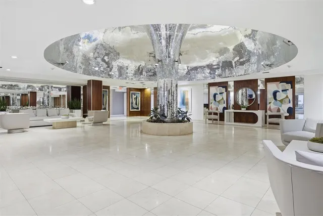 a view of swimming pool with outdoor seating