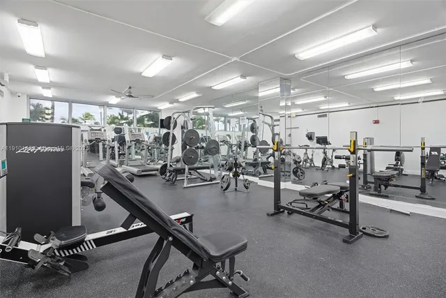a balcony with table and chairs