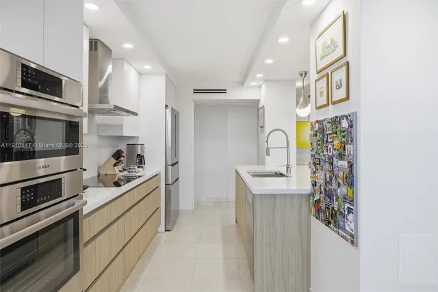 a kitchen with stainless steel appliances a stove and a refrigerator