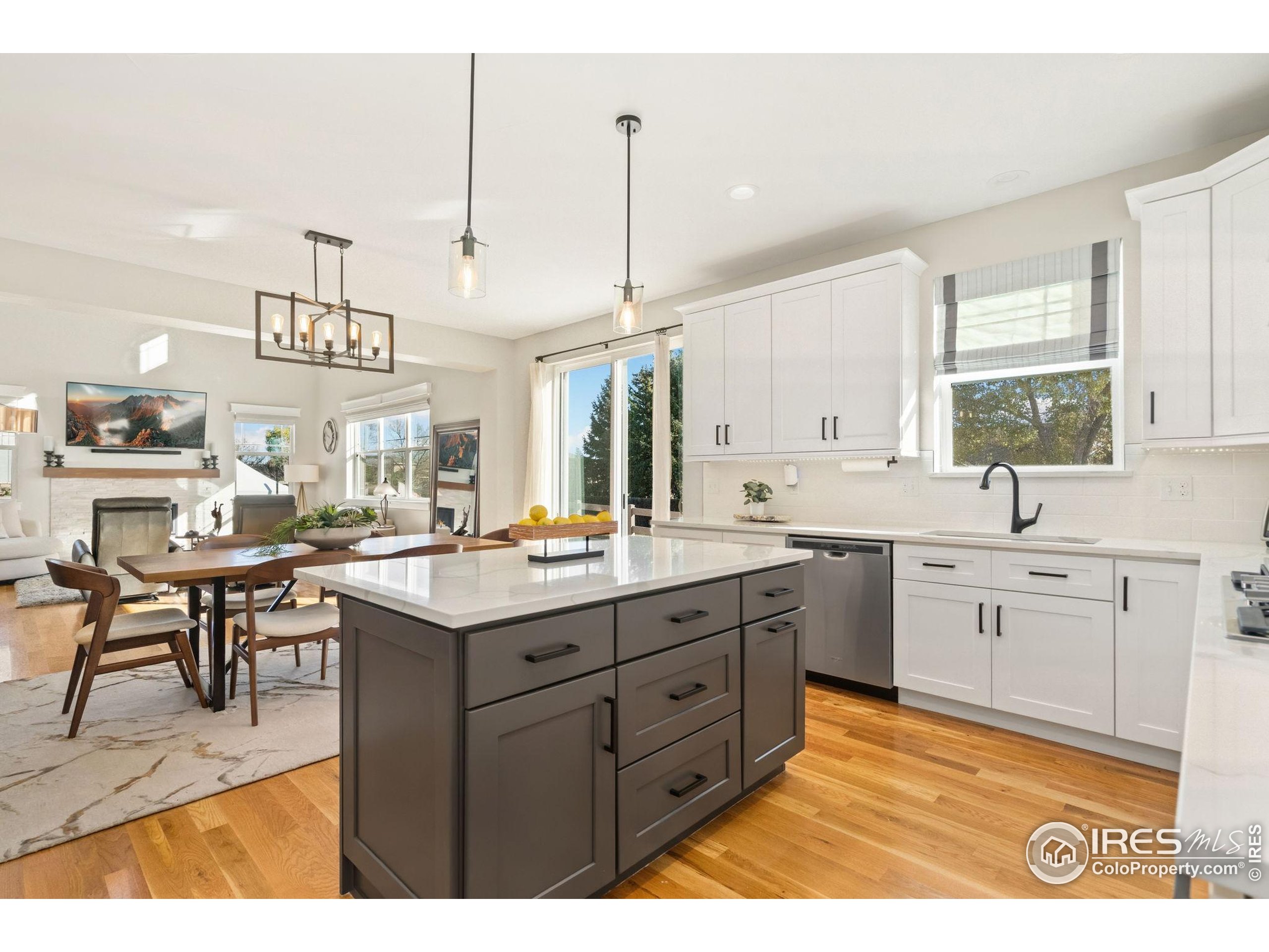 2032 Cuda Court Berthoud, CO 80513 - Photo 17 of 38 a kitchen with a sink and cabinets