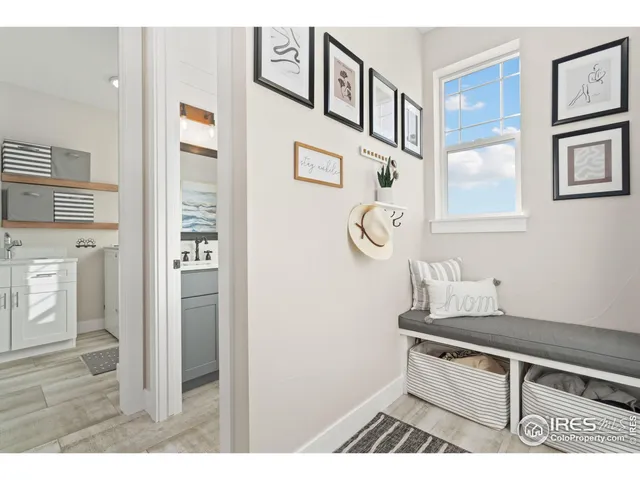 a view of an entryway and wooden floor