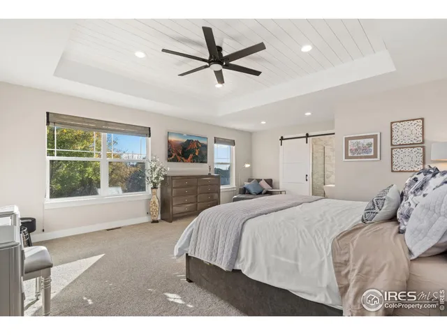 a bed room with a bed and a window