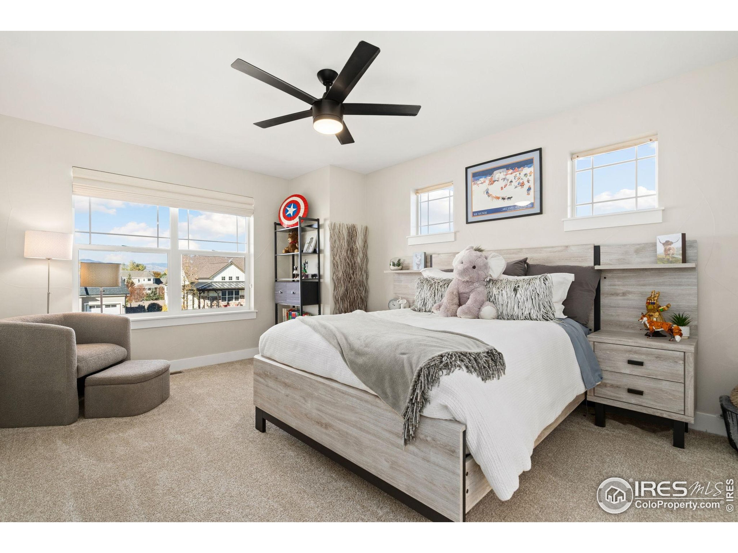 2032 Cuda Court Berthoud, CO 80513 - Photo 29 of 38 a spacious bedroom with a bed and a large window