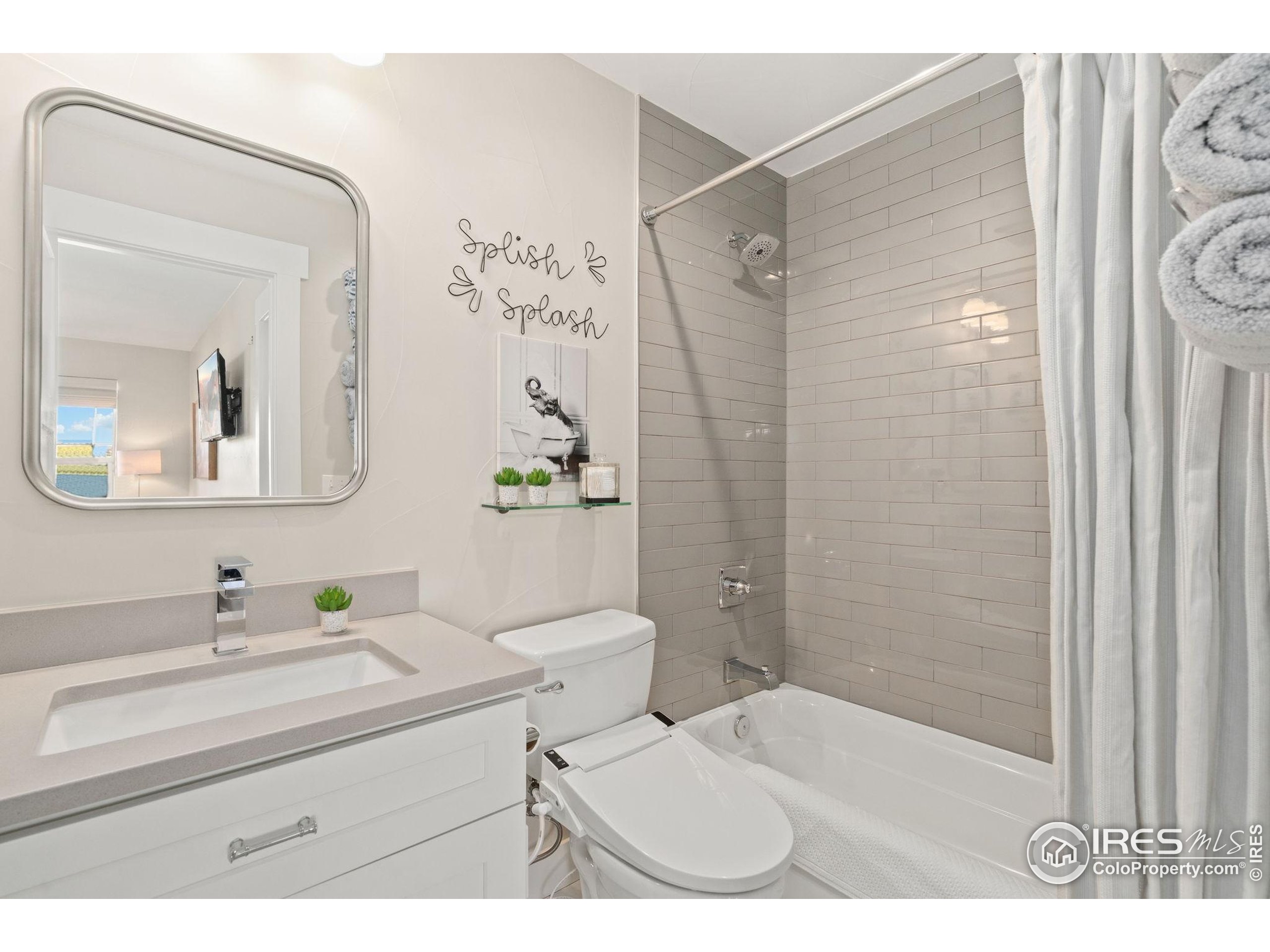 2032 Cuda Court Berthoud, CO 80513 - Photo 30 of 38 a bathroom with a sink toilet and shower