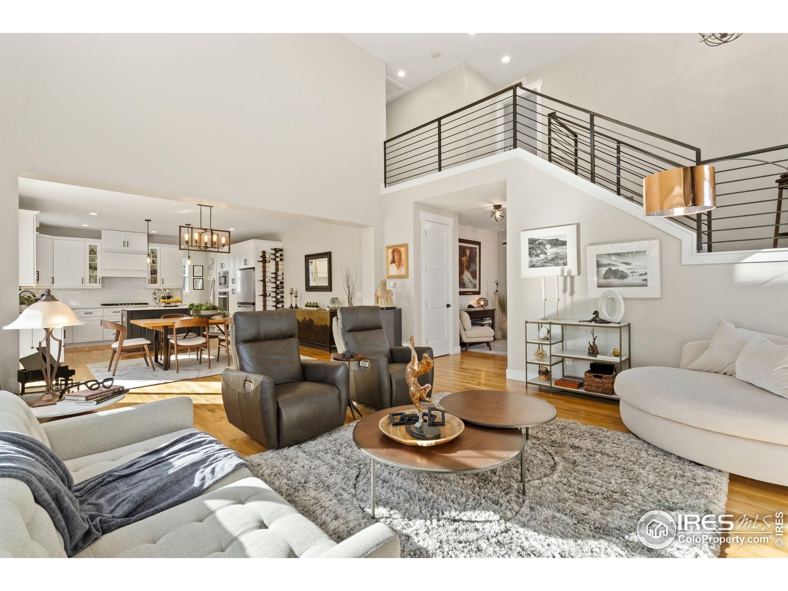 2032 Cuda Court Berthoud, CO 80513 - Photo 9 of 38 a living room with furniture a rug and white walls