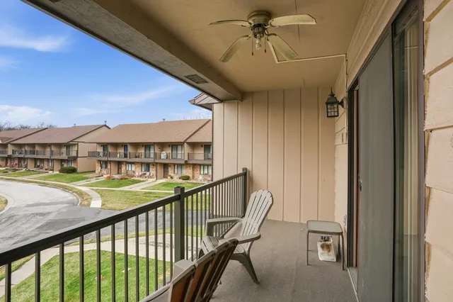 a view of a balcony with furniture