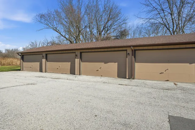 a view of garage and yard