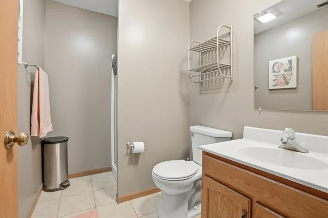 a white toilet sitting next to a bathroom sink