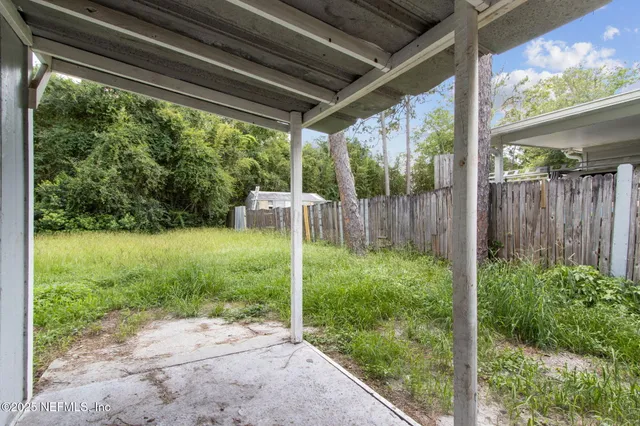 a view of backyard with green space
