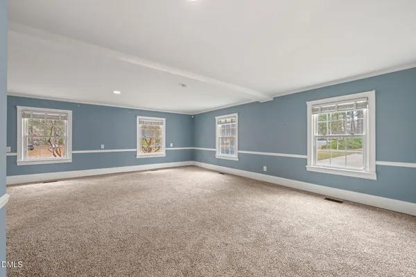 a bathroom with a granite countertop sink a toilet and shower