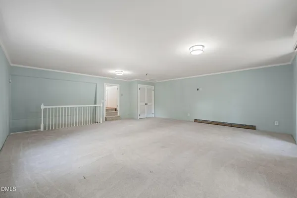 a view of a livingroom with hardwood floor and hallway