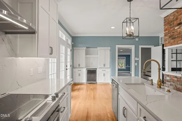 a view of an entryway with wooden floor and door