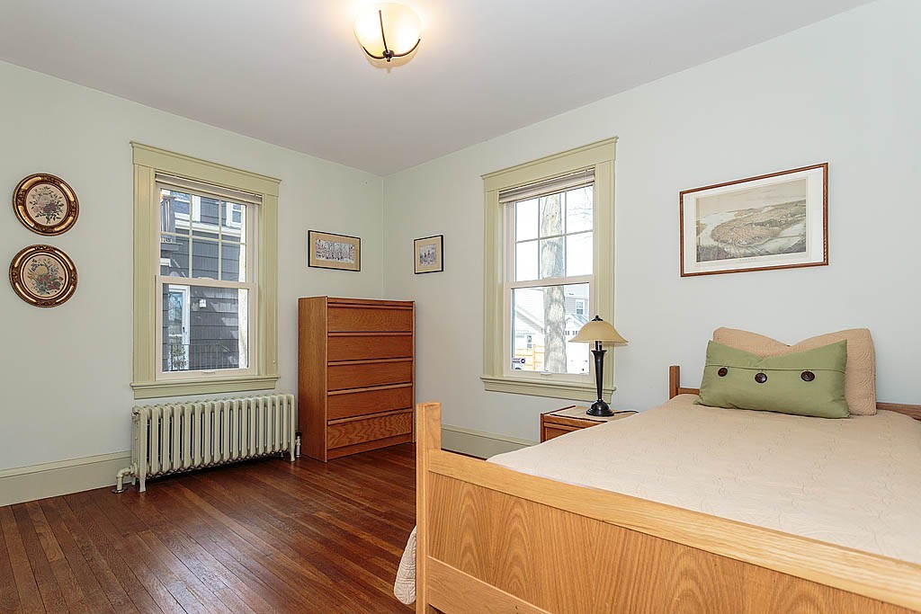 29 Ware Road Newton, MA 02466 - Photo 13 of 25 a bedroom with a bed and a window