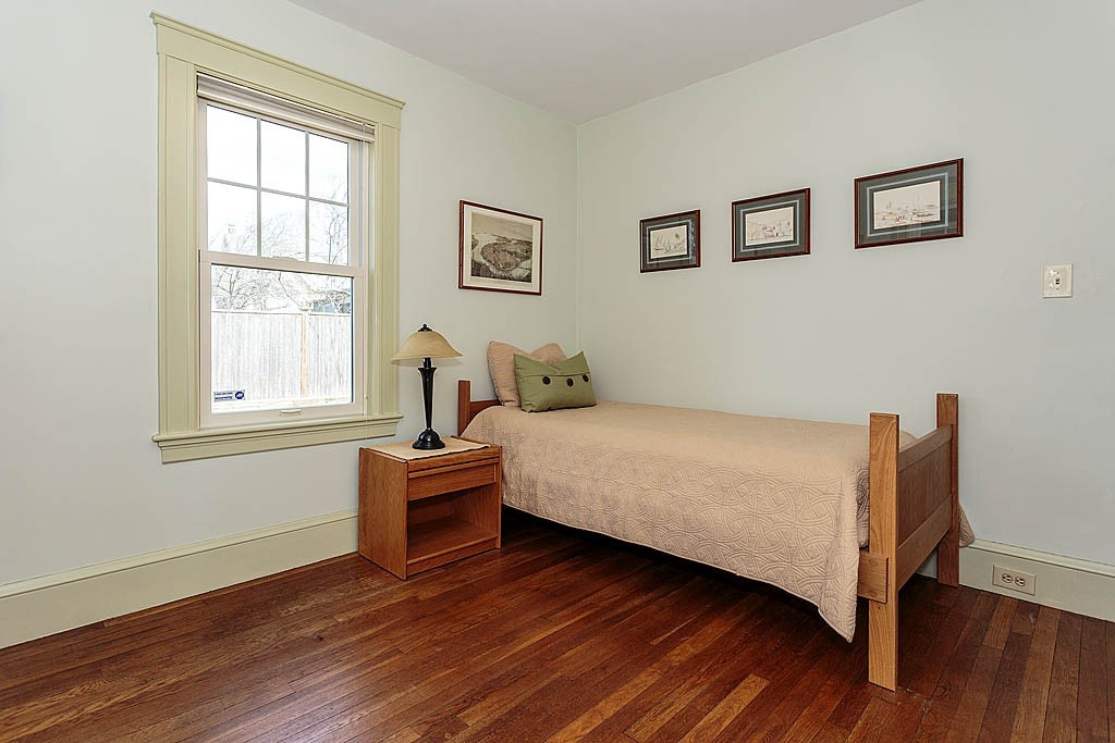29 Ware Road Newton, MA 02466 - Photo 14 of 25 a bedroom with a bed and wooden floor