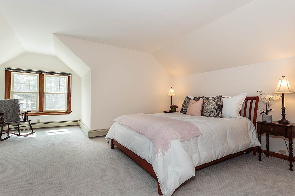 29 Ware Road Newton, MA 02466 - Photo 17 of 25 a bed room with a bed and chair
