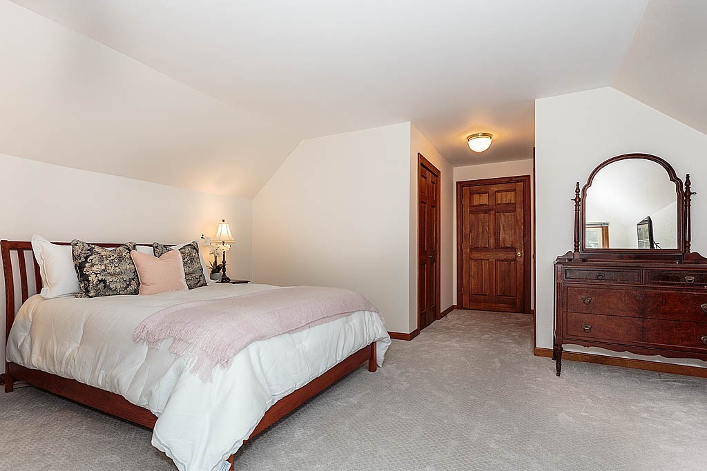 29 Ware Road Newton, MA 02466 - Photo 18 of 25 a bedroom with a bed and a dresser