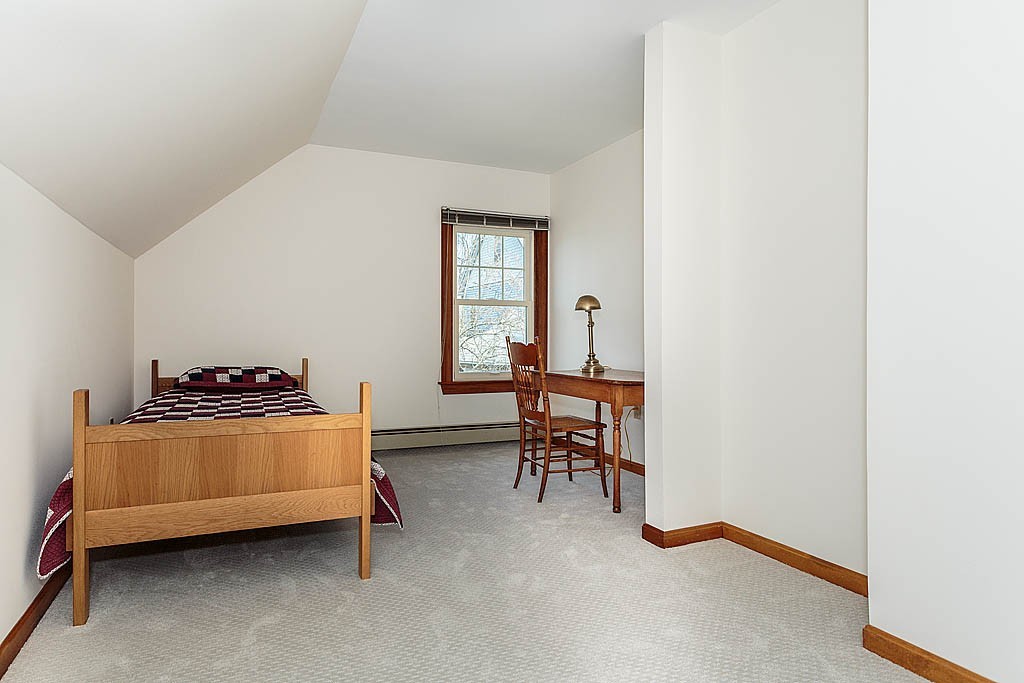 29 Ware Road Newton, MA 02466 - Photo 19 of 25 a room with furniture and a chair