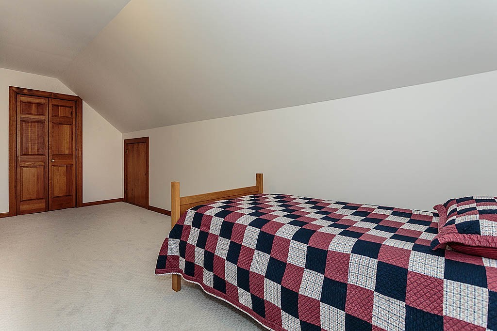 29 Ware Road Newton, MA 02466 - Photo 20 of 25 a bedroom with a bed and wooden floor