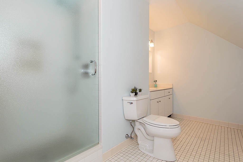 29 Ware Road Newton, MA 02466 - Photo 21 of 25 a white toilet sitting next to a bathroom sink