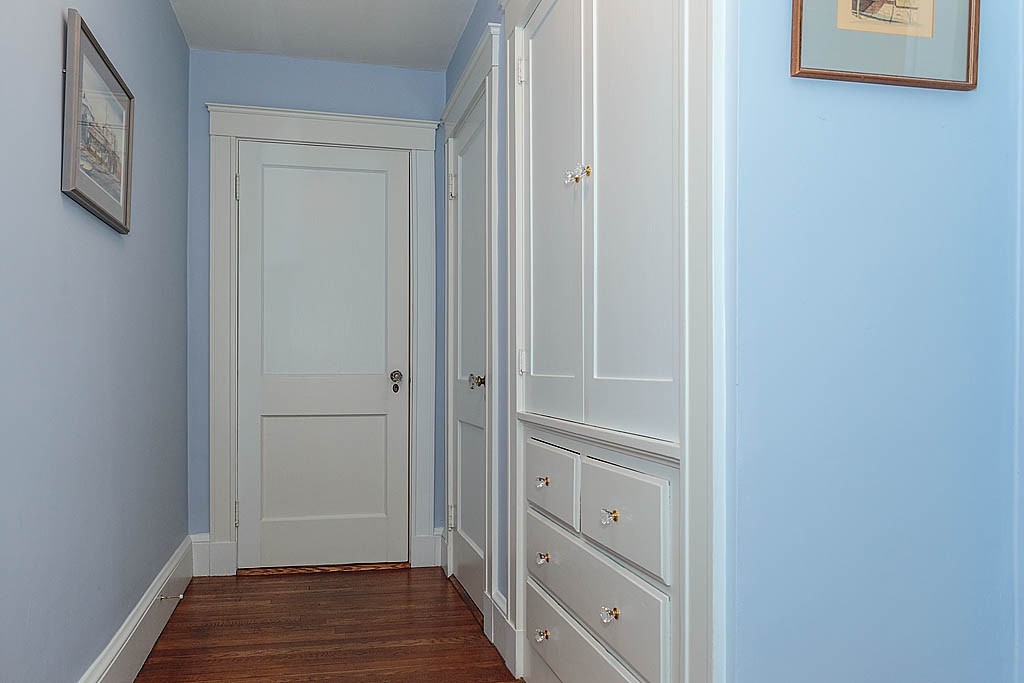 29 Ware Road Newton, MA 02466 - Photo 22 of 25 a view of a hallway with wooden floor