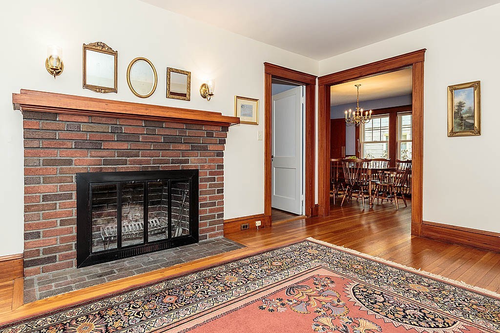 29 Ware Road Newton, MA 02466 - Photo 5 of 25 a living room with furniture and a fireplace