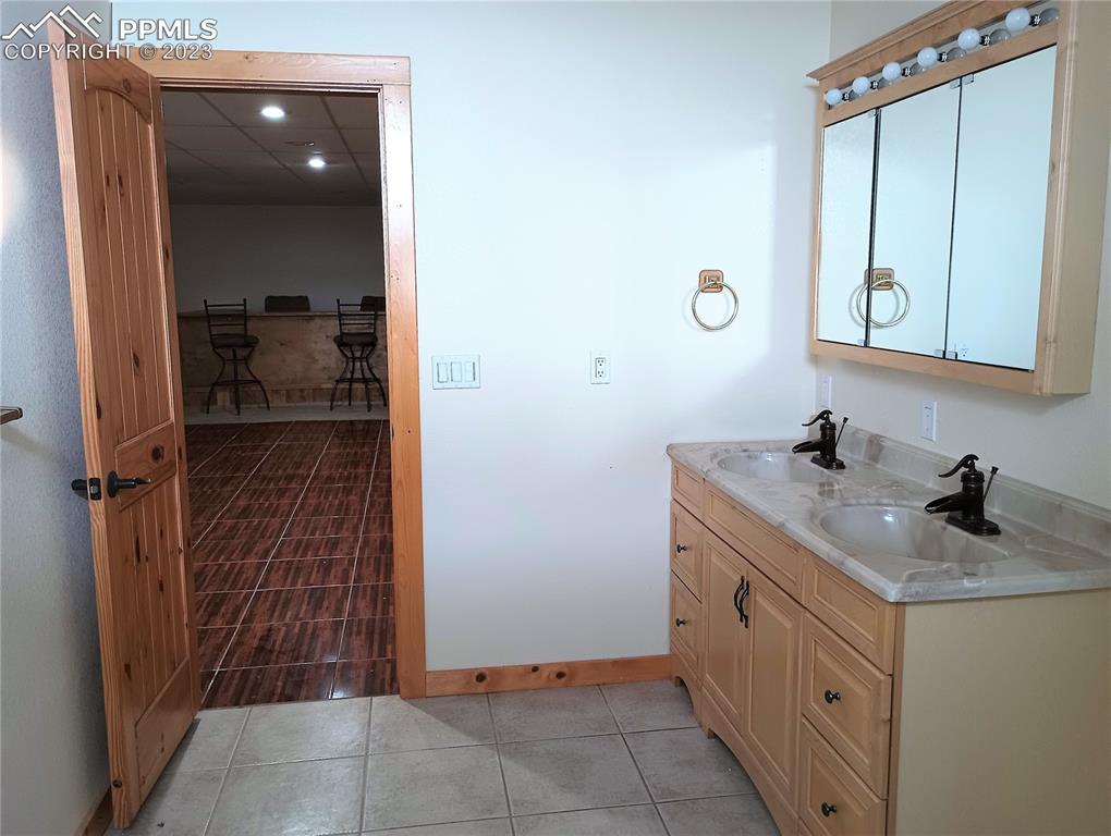 1260 County Road South Rush, CO 80833 - Photo 20 of 41 a bathroom with a sink a toilet and shower