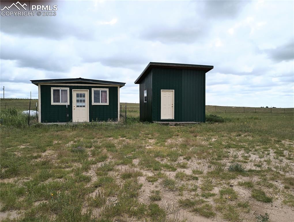 1260 County Road South Rush, CO 80833 - Photo 33 of 41 a house with yard in front of it