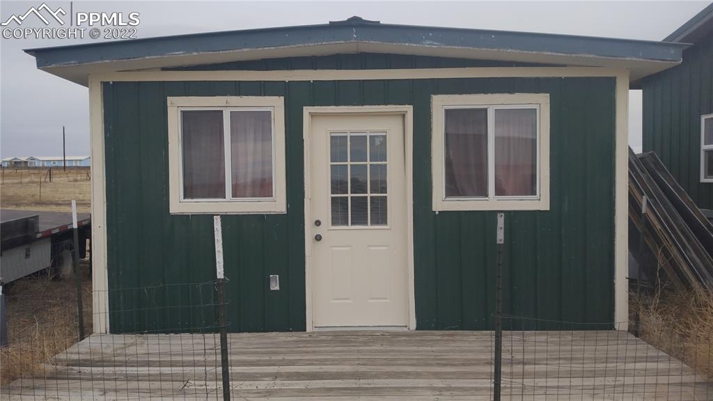 1260 County Road South Rush, CO 80833 - Photo 34 of 41 a view of a house with a door
