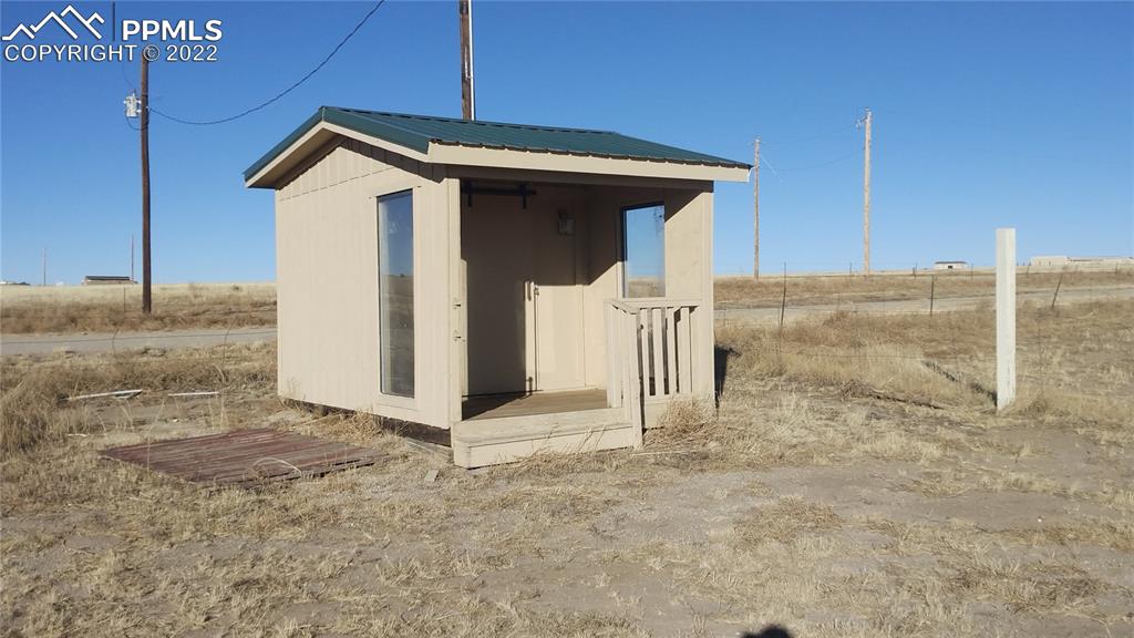 1260 County Road South Rush, CO 80833 - Photo 40 of 41 a view of a house with a wooden fence