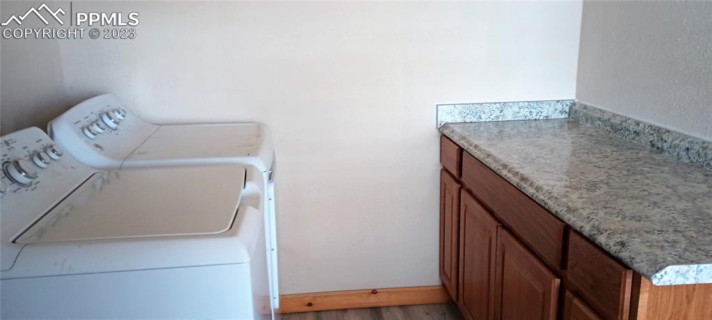 1260 County Road South Rush, CO 80833 - Photo 5 of 41 a utility room with dryer and washer
