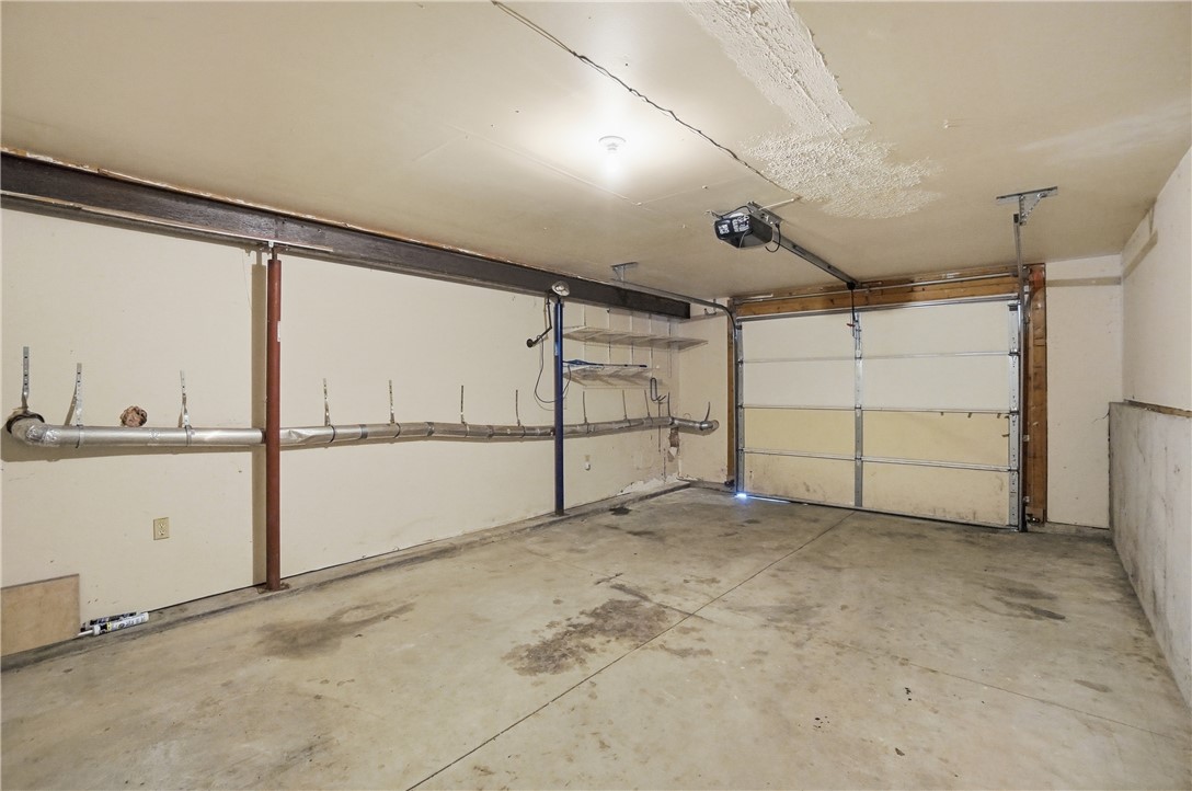 1208 Jarva Lane Springboro, OH 45066 - Photo 68 of 75 This spacious garage offers practical storage solutions and direct access for vehicles.