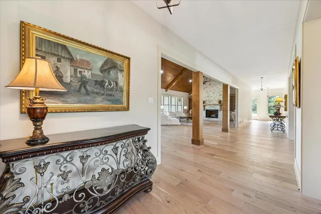 a view of an entryway with wooden floor