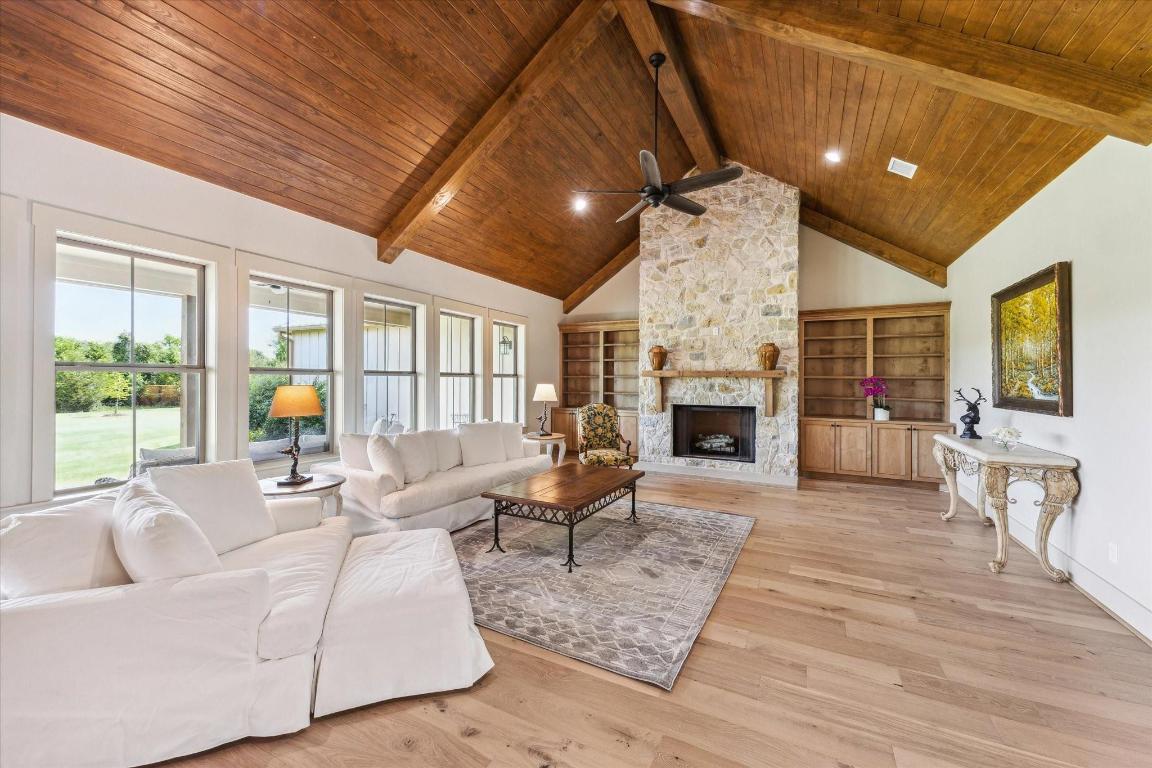 2130 Hartfield Road Round Top, TX 78954 - Photo 26 of 39 a living room with furniture fireplace and flat screen tv