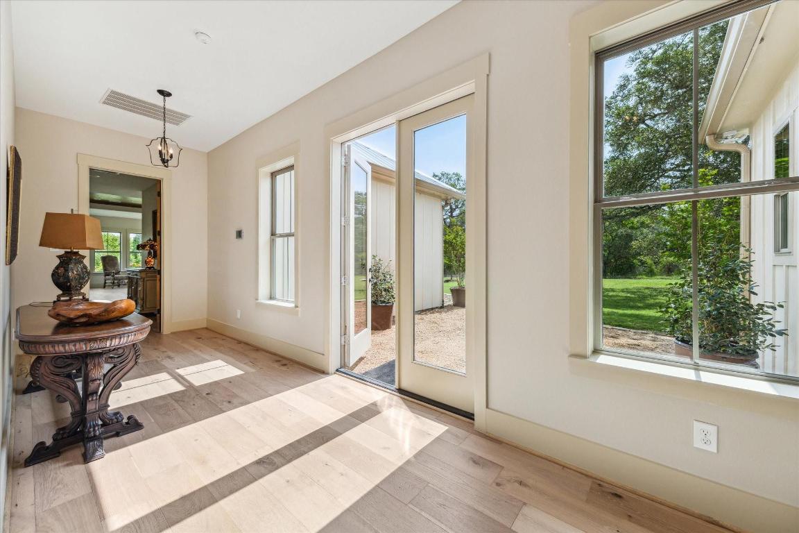2130 Hartfield Road Round Top, TX 78954 - Photo 28 of 39 a view of a room that has a bed and wooden floor