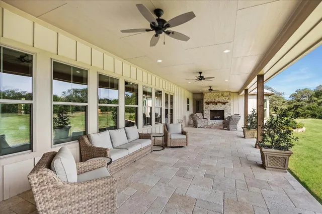 an aerial view of a house with yard