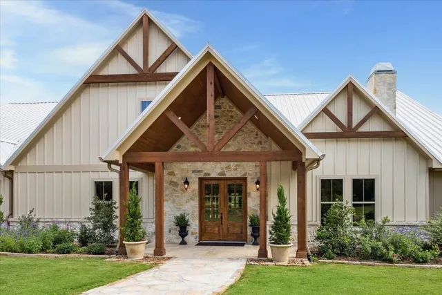 a front view of a house with a yard and porch