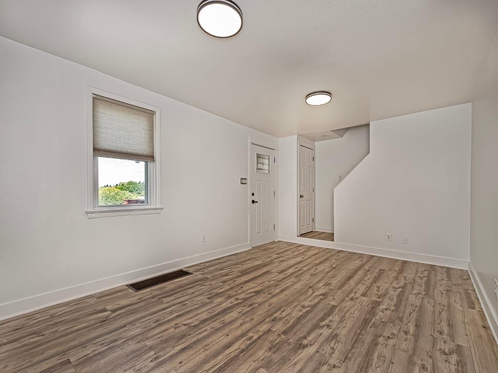 480 Hamil Road Verona, PA 15147 - Photo 6 of 27 Large living room with fresh paint and new flooring.