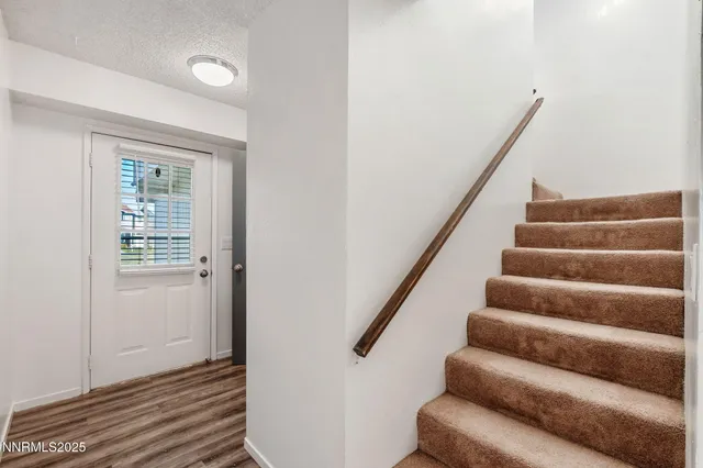 a bedroom with bed and furniture