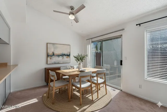 a living room with a bed furniture and a window