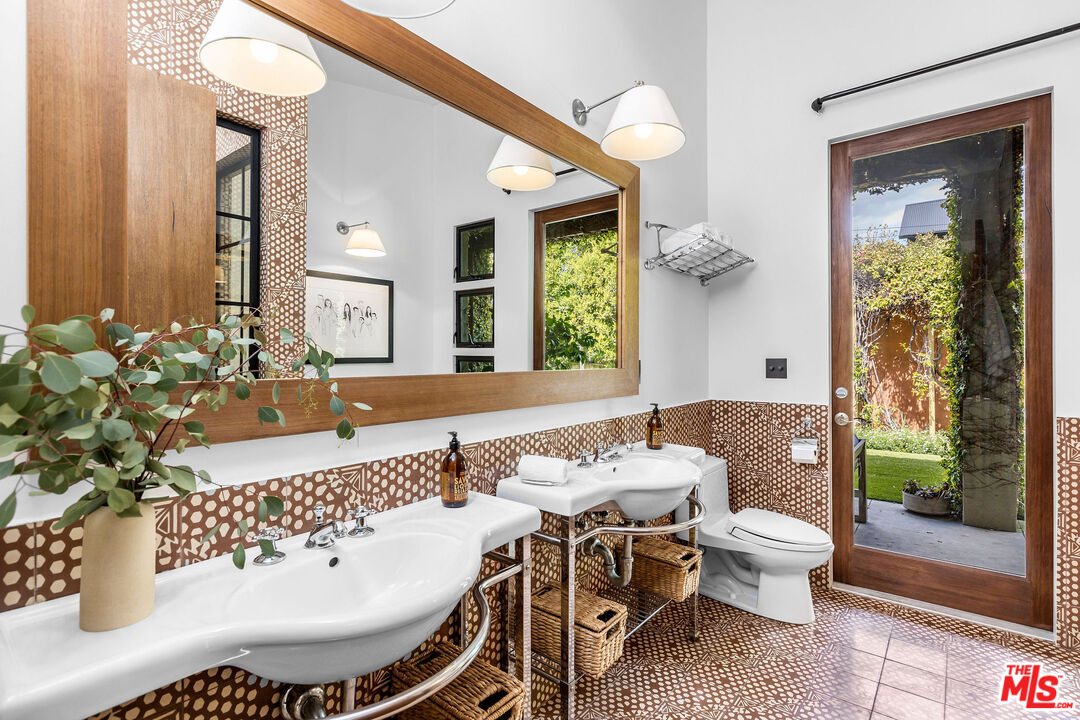2211 Glencoe Avenue Venice, CA 90291 - Photo 11 of 19 a bathroom with a sink and a mirror